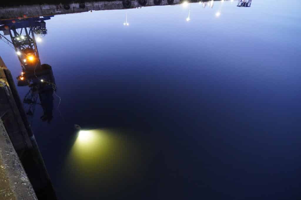 A Blueye underwater drone lights up the harbor water at Nyhavna. Photo: Lars Bugge Aarset/Ocean Autonomy Cluster.